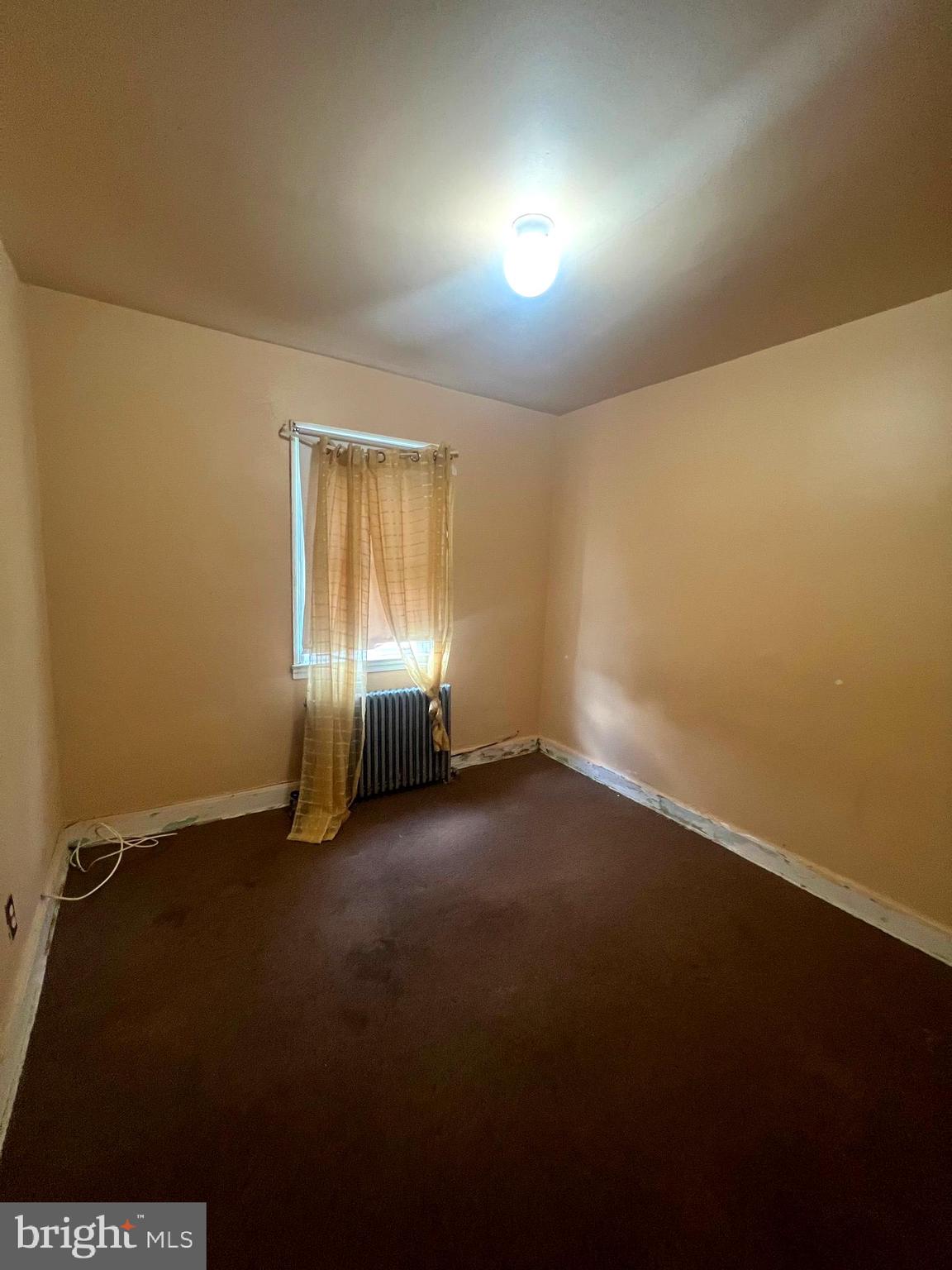 3716 Flowerton Road Baltimore, MD 21229 - Photo 7 of 12 an empty room with windows