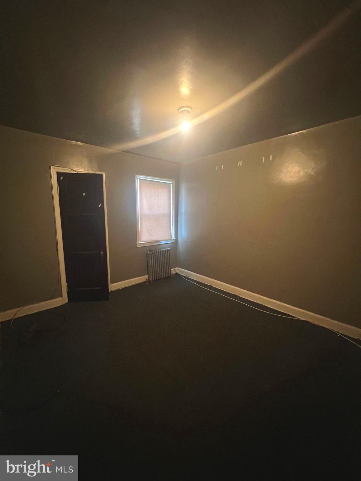 3716 Flowerton Road Baltimore, MD 21229 - Photo 8 of 12 an empty room with windows