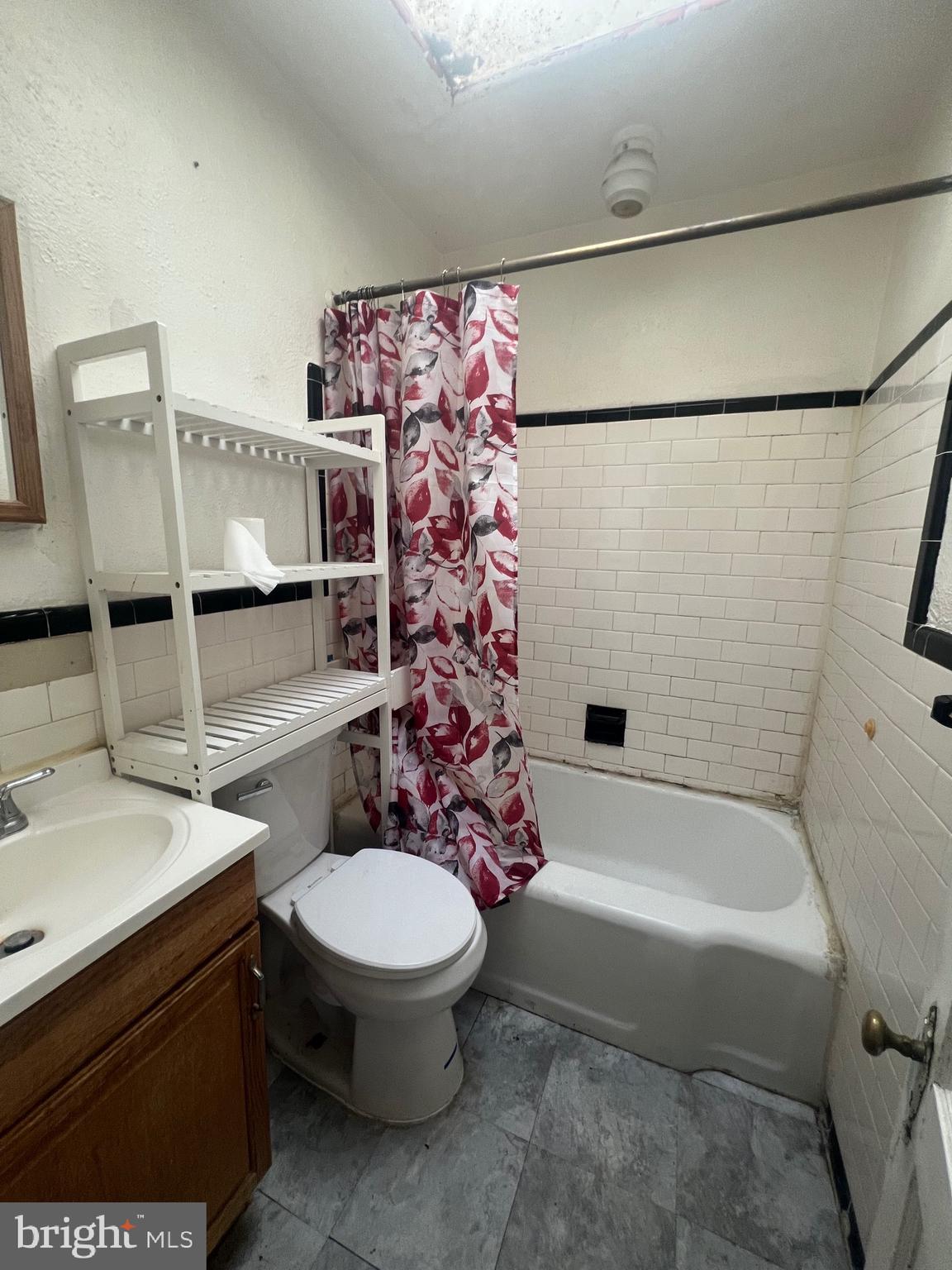 3716 Flowerton Road Baltimore, MD 21229 - Photo 9 of 12 a bathroom with a sink toilet and shower