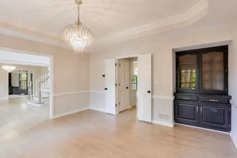 a kitchen with granite countertop a sink cabinets and window