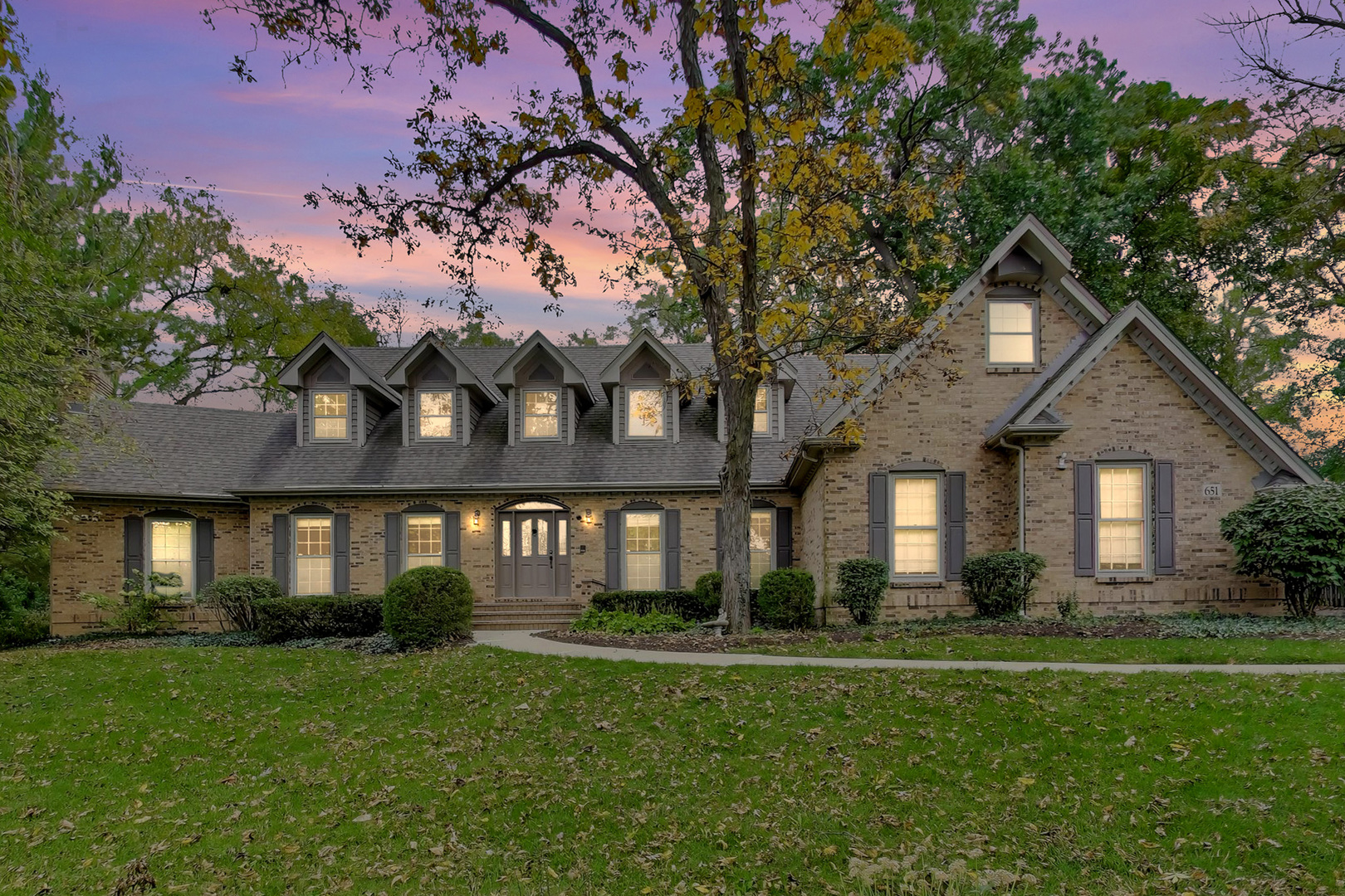 651 Nor-Oaks Court West Chicago, IL 60185 - Photo 2 of 62 a front view of a house with a yard
