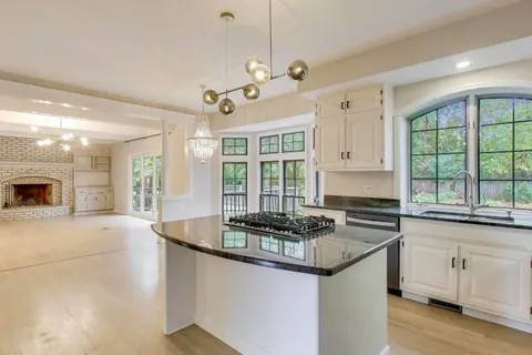 an empty room with windows and view