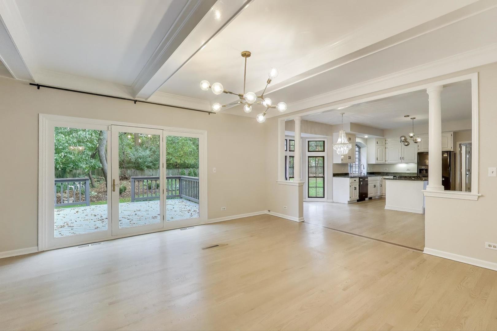 651 Nor-Oaks Court West Chicago, IL 60185 - Photo 25 of 62 a view of an empty room with a fireplace and a large window