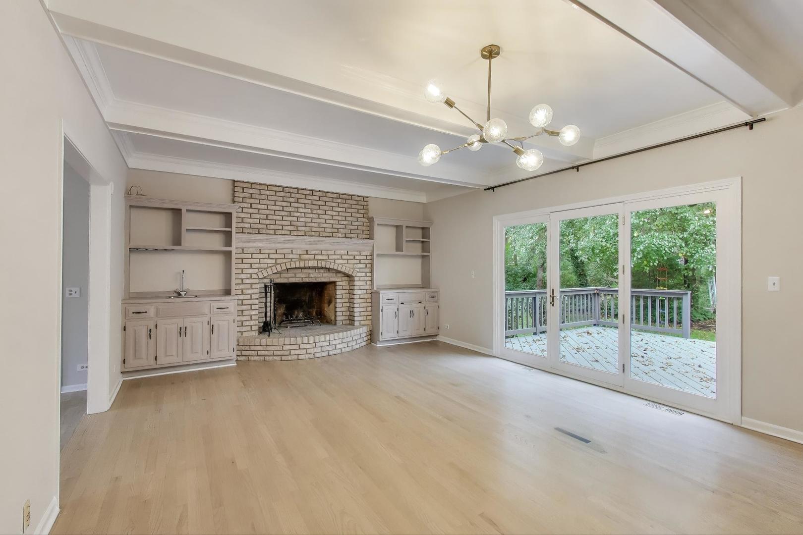 651 Nor-Oaks Court West Chicago, IL 60185 - Photo 26 of 62 a view of an empty room with a fireplace and a window