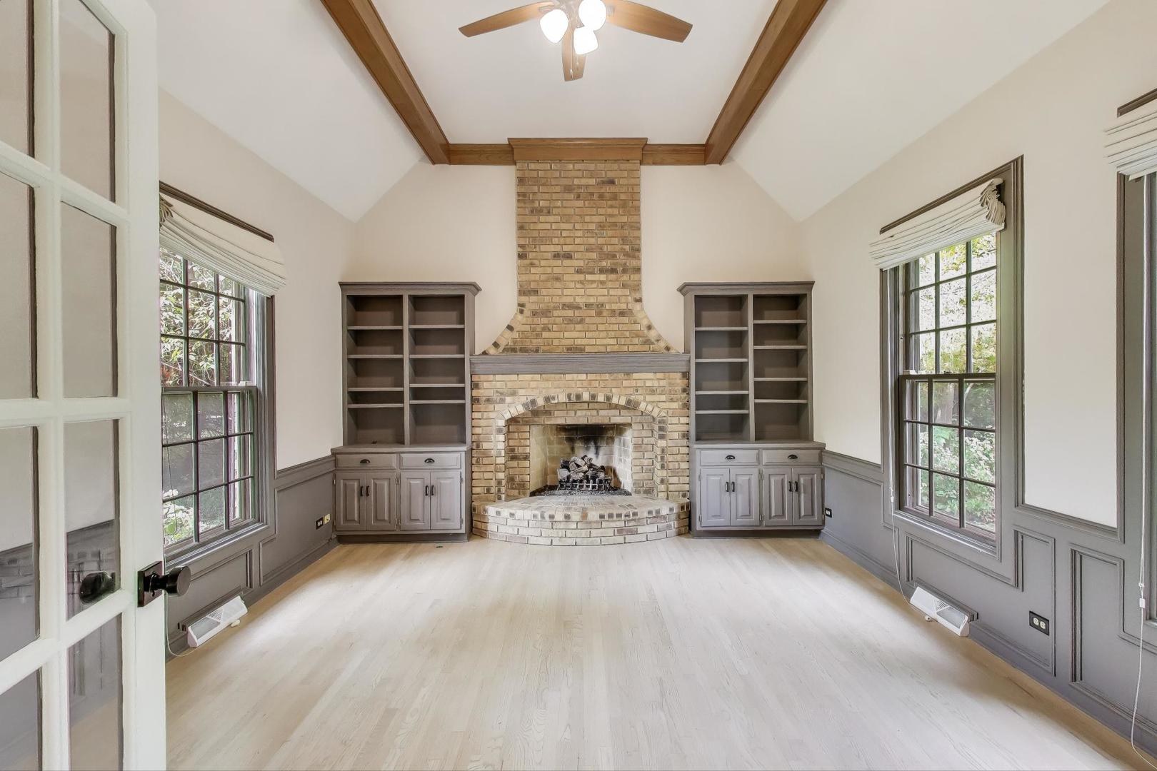 651 Nor-Oaks Court West Chicago, IL 60185 - Photo 27 of 62 a view of a livingroom with a fireplace and window