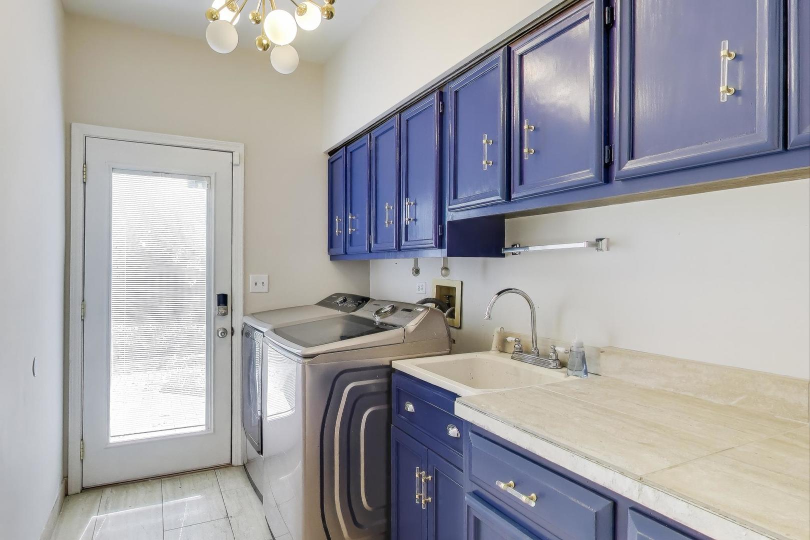 651 Nor-Oaks Court West Chicago, IL 60185 - Photo 29 of 62 a view of a kitchen with sink cabinets and appliances