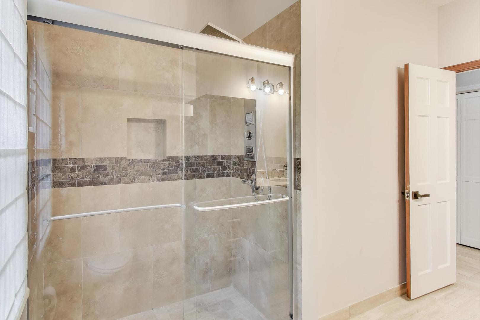 651 Nor-Oaks Court West Chicago, IL 60185 - Photo 33 of 62 a bathroom with a bathtub and a shower