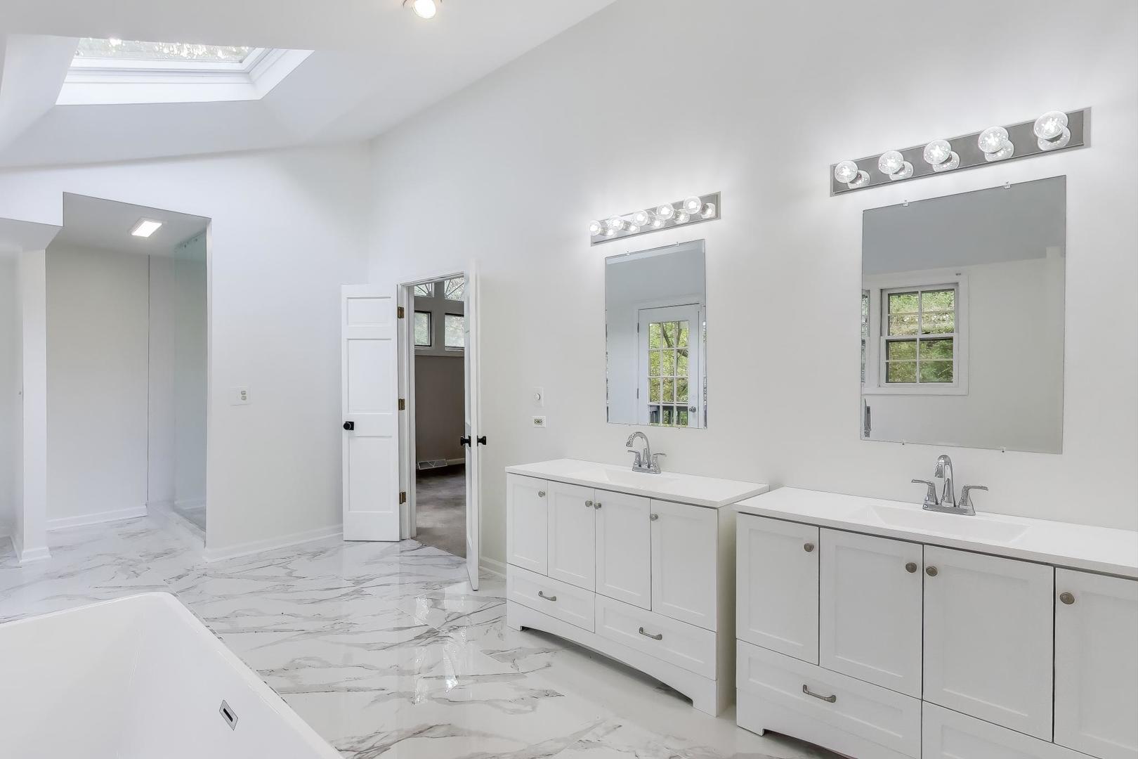 651 Nor-Oaks Court West Chicago, IL 60185 - Photo 40 of 62 a spacious bathroom with a double vanity sink mirror and