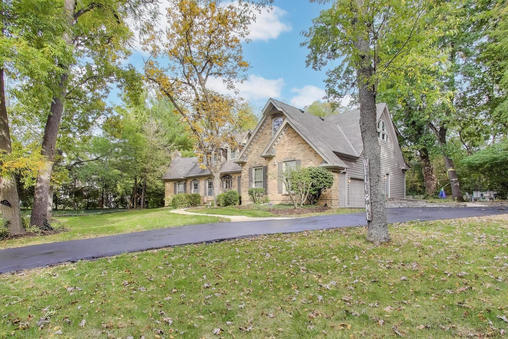 651 Nor-Oaks Court West Chicago, IL 60185 - Photo 4 of 62 a view of house with a big yard and large trees