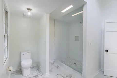 a view of empty room with wooden ceiling
