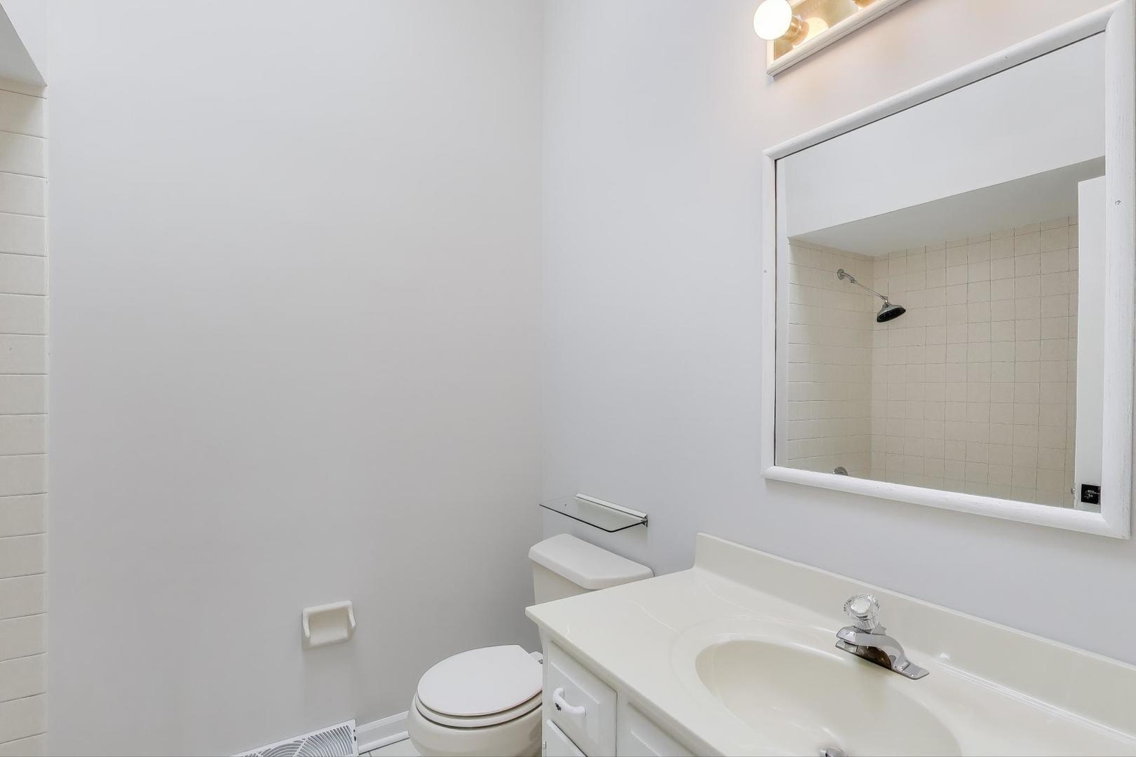 651 Nor-Oaks Court West Chicago, IL 60185 - Photo 46 of 62 a bathroom with a sink and a toilet