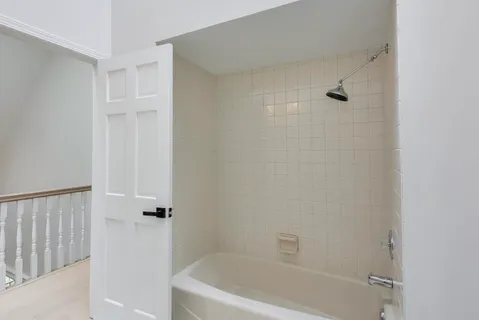 a view of deck and backyard with trees