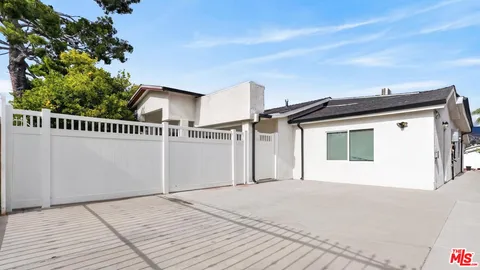 a kitchen with stainless steel appliances a refrigerator sink and microwave