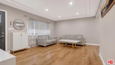 a kitchen with stainless steel appliances granite countertop a stove a microwave and a refrigerator
