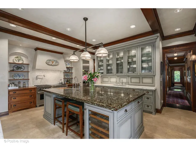 a living room with furniture and floor to ceiling windows