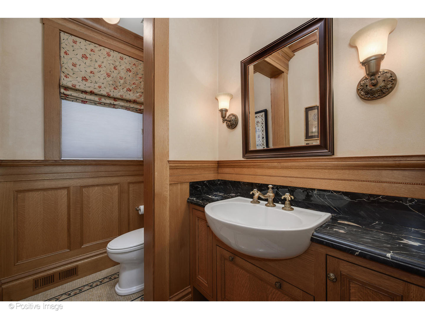 536 West Barry Avenue Chicago, IL 60657 - Photo 22 of 55 a bathroom with a sink a toilet and mirror