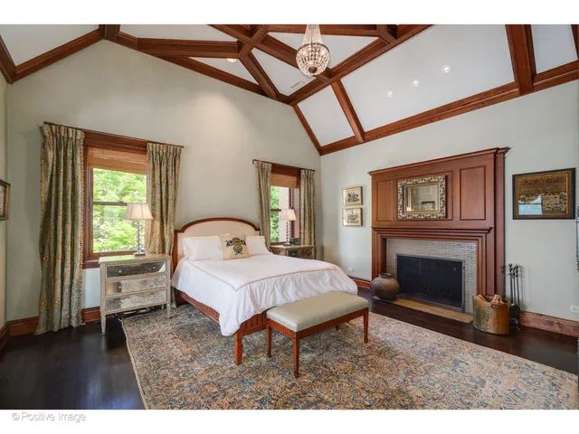 a kitchen with a sink a refrigerator and cabinets