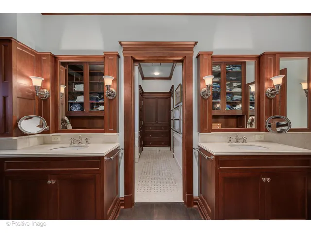 a bathroom with a sink double vanity and a mirror