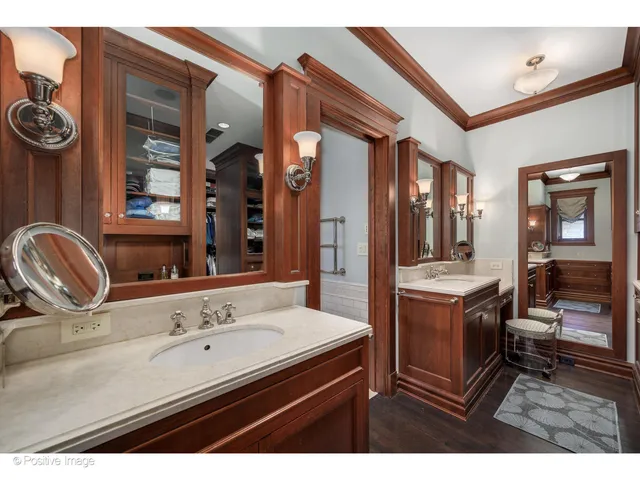 a bathroom with a bathtub sink and mirror