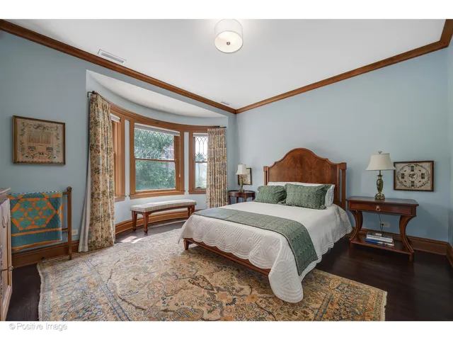 a bathroom with a tub a sink and mirror