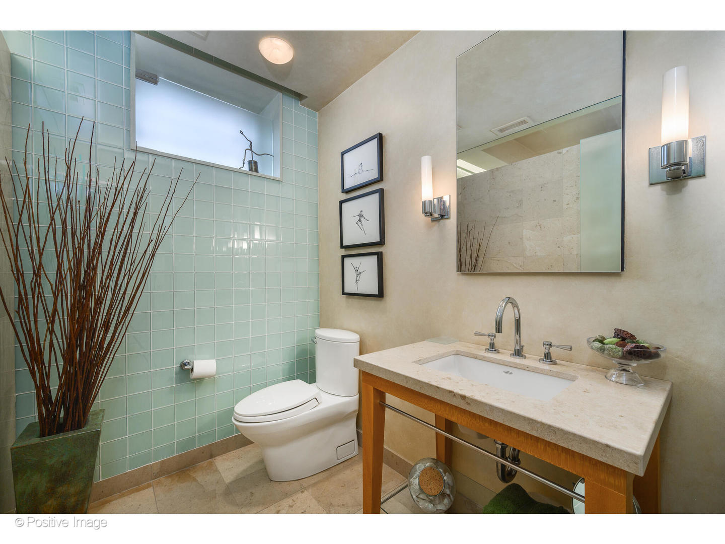 536 West Barry Avenue Chicago, IL 60657 - Photo 41 of 55 a bathroom with a sink a toilet and a mirror