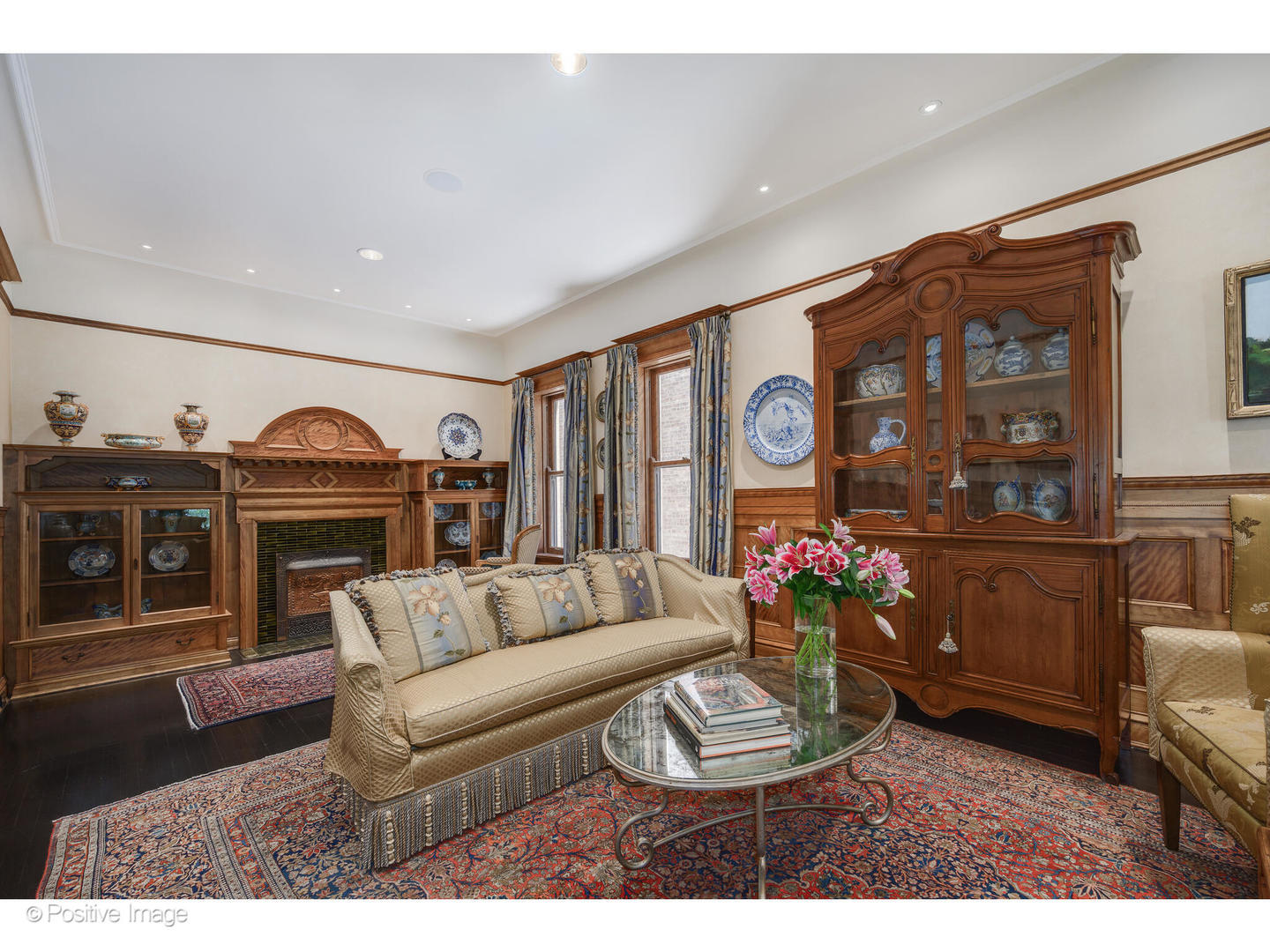 536 West Barry Avenue Chicago, IL 60657 - Photo 8 of 55 a living room with furniture a chandelier and a fireplace