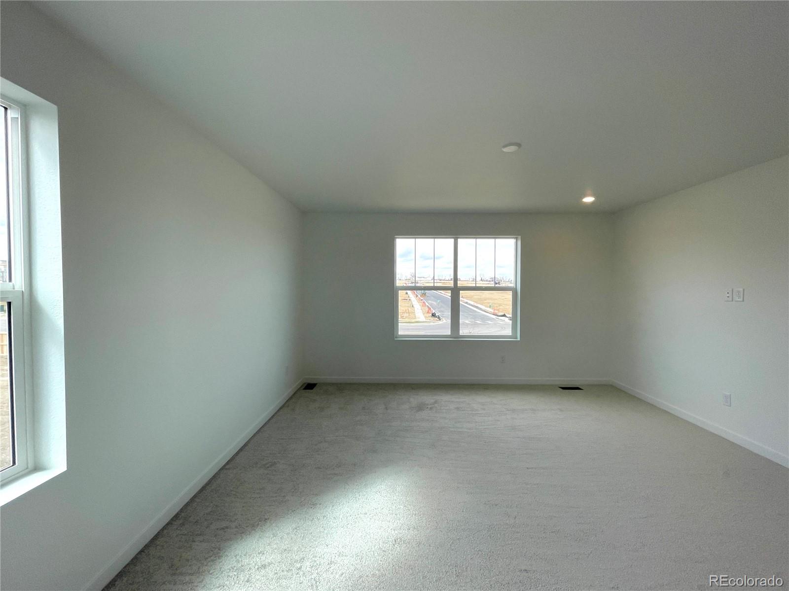 4089 Amanda Drive Johnstown, CO 80534 - Photo 7 of 16 an empty room with a window