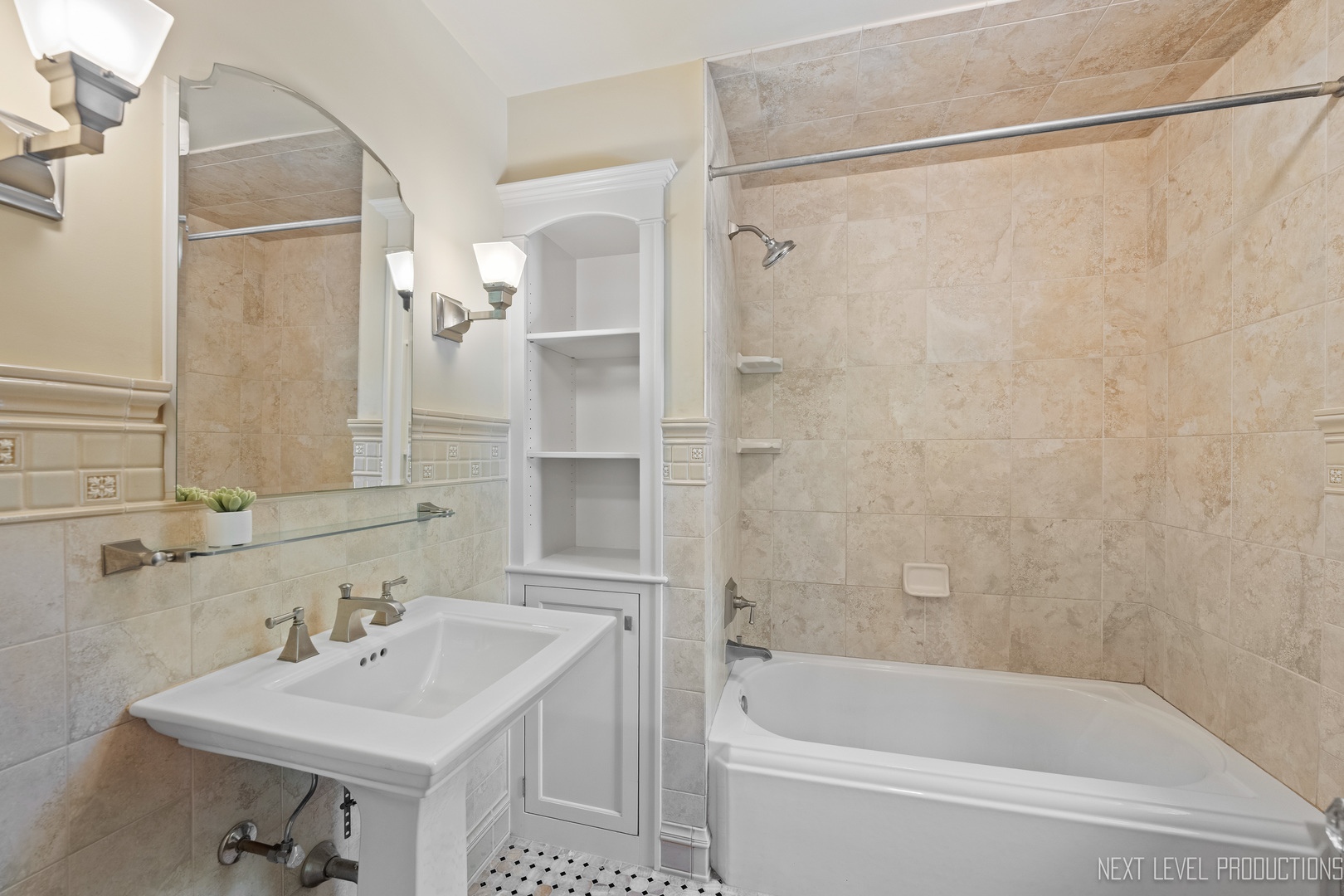 1205 South 4th Street St. Charles, IL 60174 - Photo 17 of 28 a bathroom with a sink mirror and a bathtub