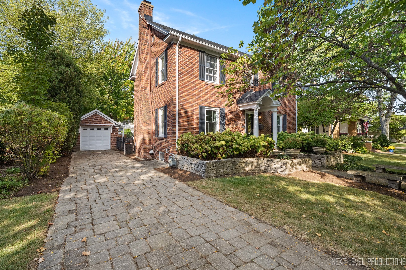 1205 South 4th Street St. Charles, IL 60174 - Photo 2 of 28 a front view of a house with garden