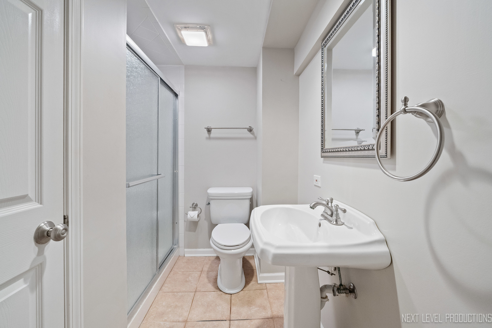 1205 South 4th Street St. Charles, IL 60174 - Photo 21 of 28 a bathroom with a sink toilet and a mirror