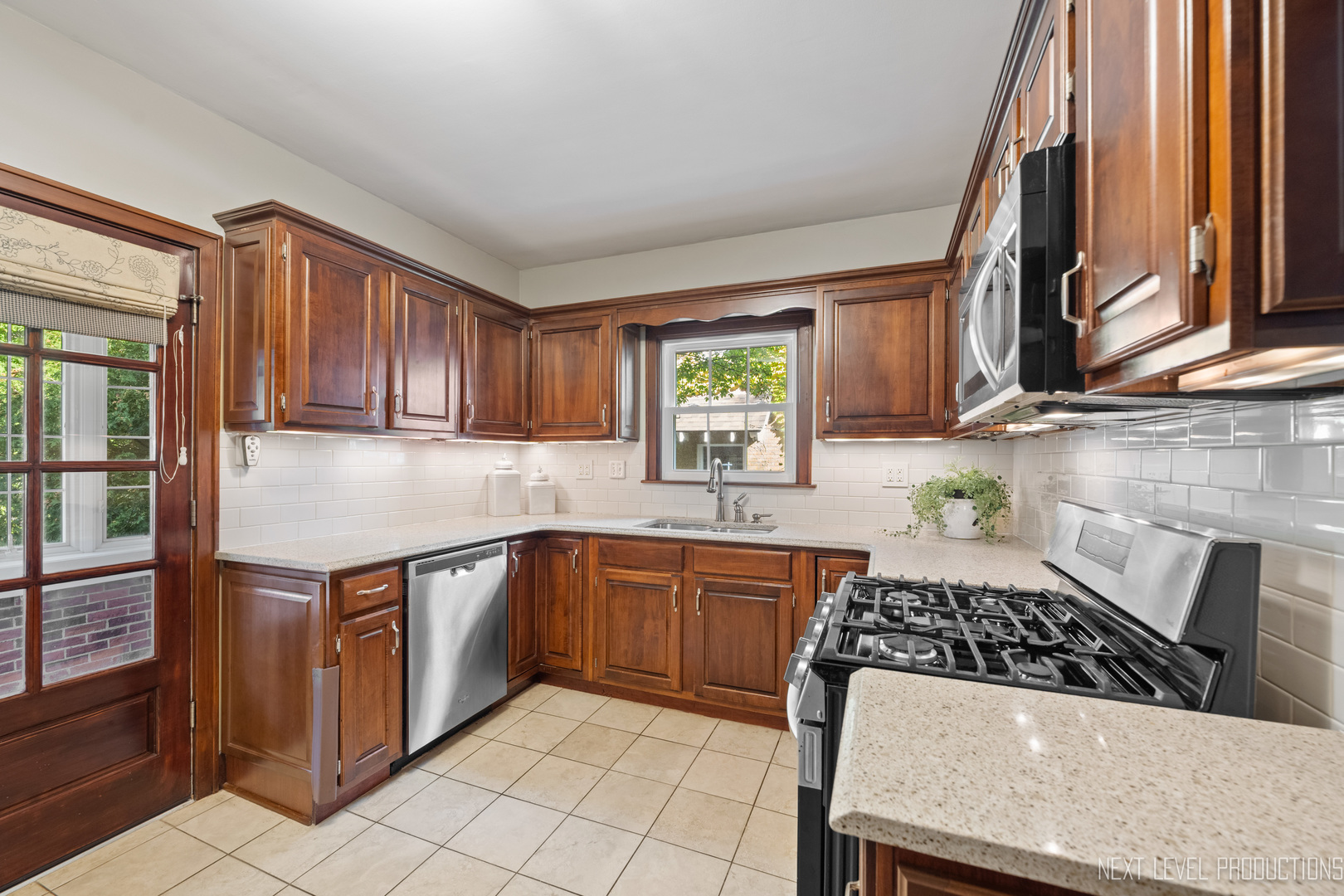 1205 South 4th Street St. Charles, IL 60174 - Photo 10 of 28 a kitchen with stainless steel appliances a sink stove and cabinets