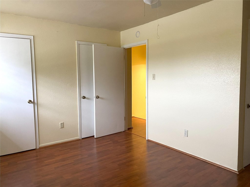 7831 Fuqua Street, Unit 7831 Houston, TX 77075 - Photo 2 of 15 an empty room with wooden floor and a window