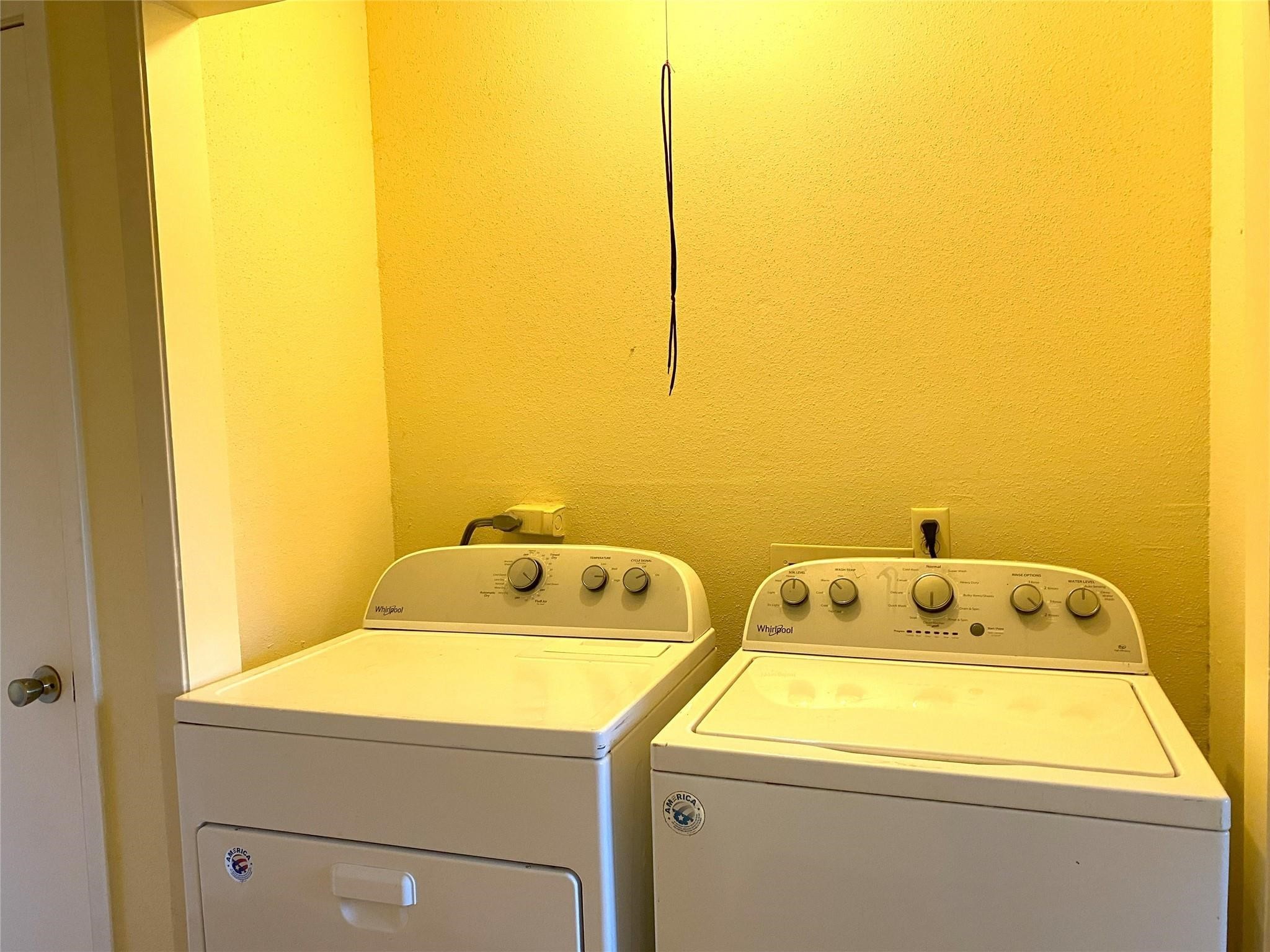 7831 Fuqua Street, Unit 7831 Houston, TX 77075 - Photo 7 of 15 a utility room with dryer and washer