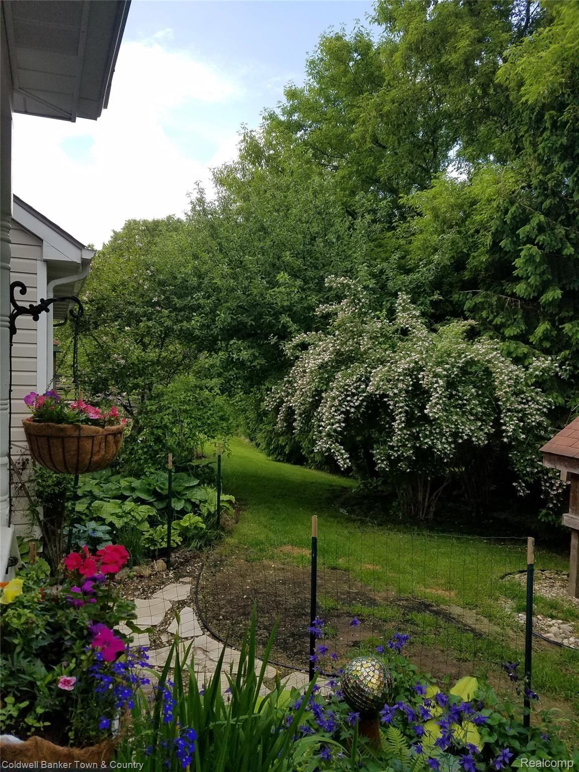 2881 East Jones Road Howell, MI 48855 - Photo 73 of 76 You will love all the flowers and the landscaping