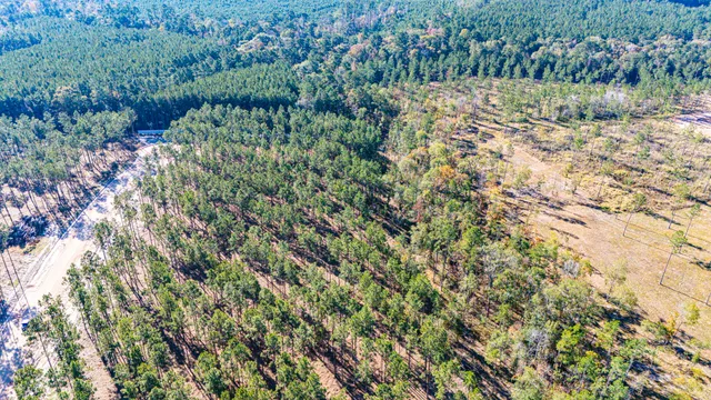a view of a lake with top of a house