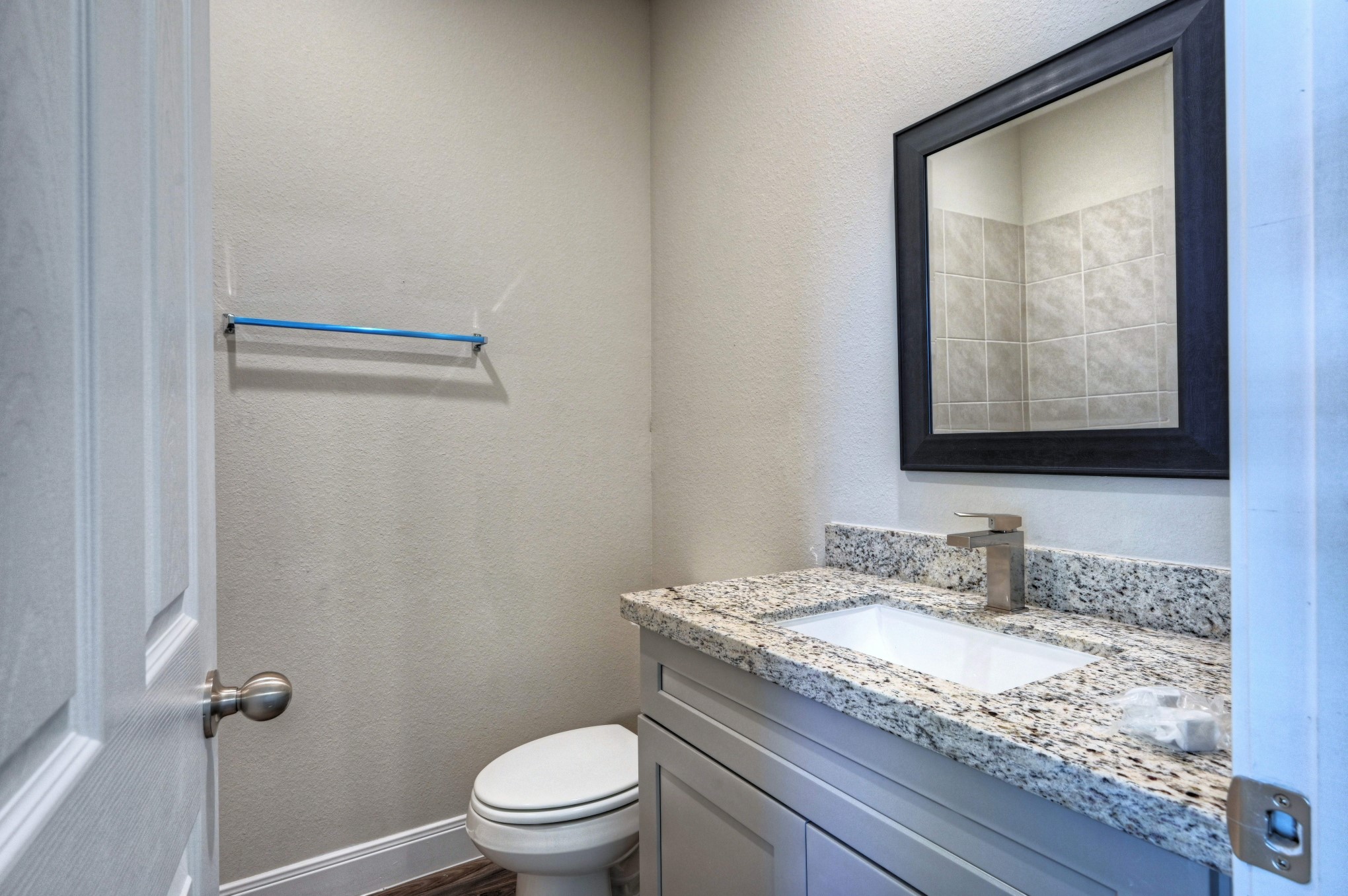 9173 Inwood Willis, TX 77318 - Photo 24 of 31 a bathroom with a granite countertop sink toilet and mirror