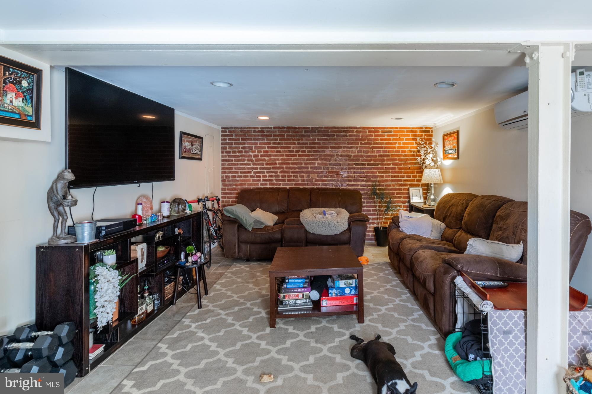 1927 Park Road Northwest Washington, DC 20010 - Photo 56 of 61 In-law suite living room/bedroom w/ exposed brick