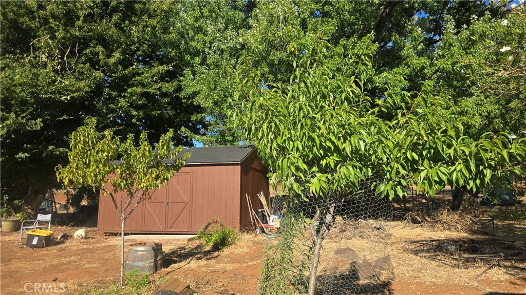 1833 Stark Lane Paradise, CA 95969 - Photo 14 of 28 a potted plant is sitting in front of a house