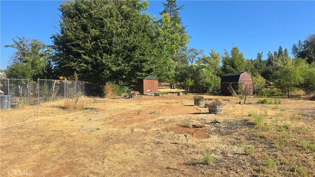 1833 Stark Lane Paradise, CA 95969 - Photo 6 of 28 a swimming pool with outdoor seating and yard