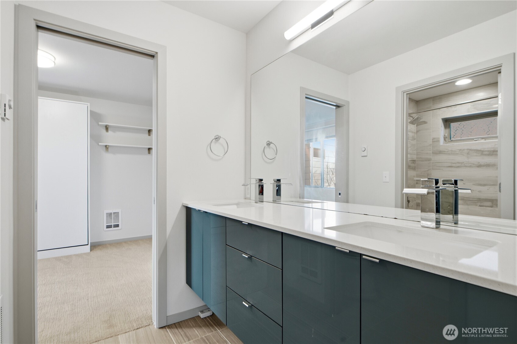 4416 Francis Avenue North, Unit B Seattle, WA 98103 - Photo 11 of 26 a bathroom with a double vanity sink and mirror