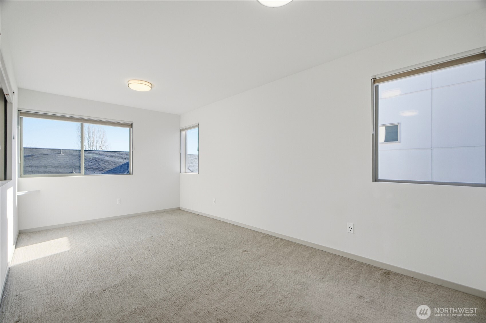 4416 Francis Avenue North, Unit B Seattle, WA 98103 - Photo 17 of 26 an empty room with a window