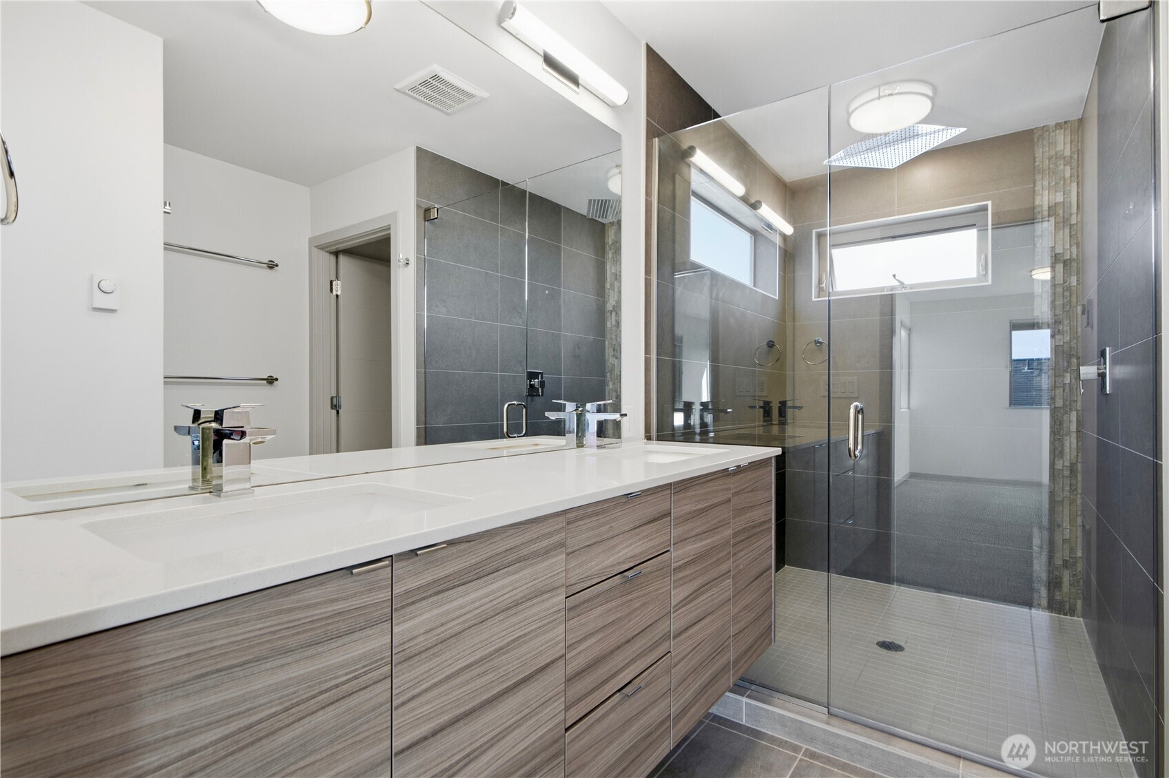 4416 Francis Avenue North, Unit B Seattle, WA 98103 - Photo 19 of 26 a bathroom with a shower sink and mirror