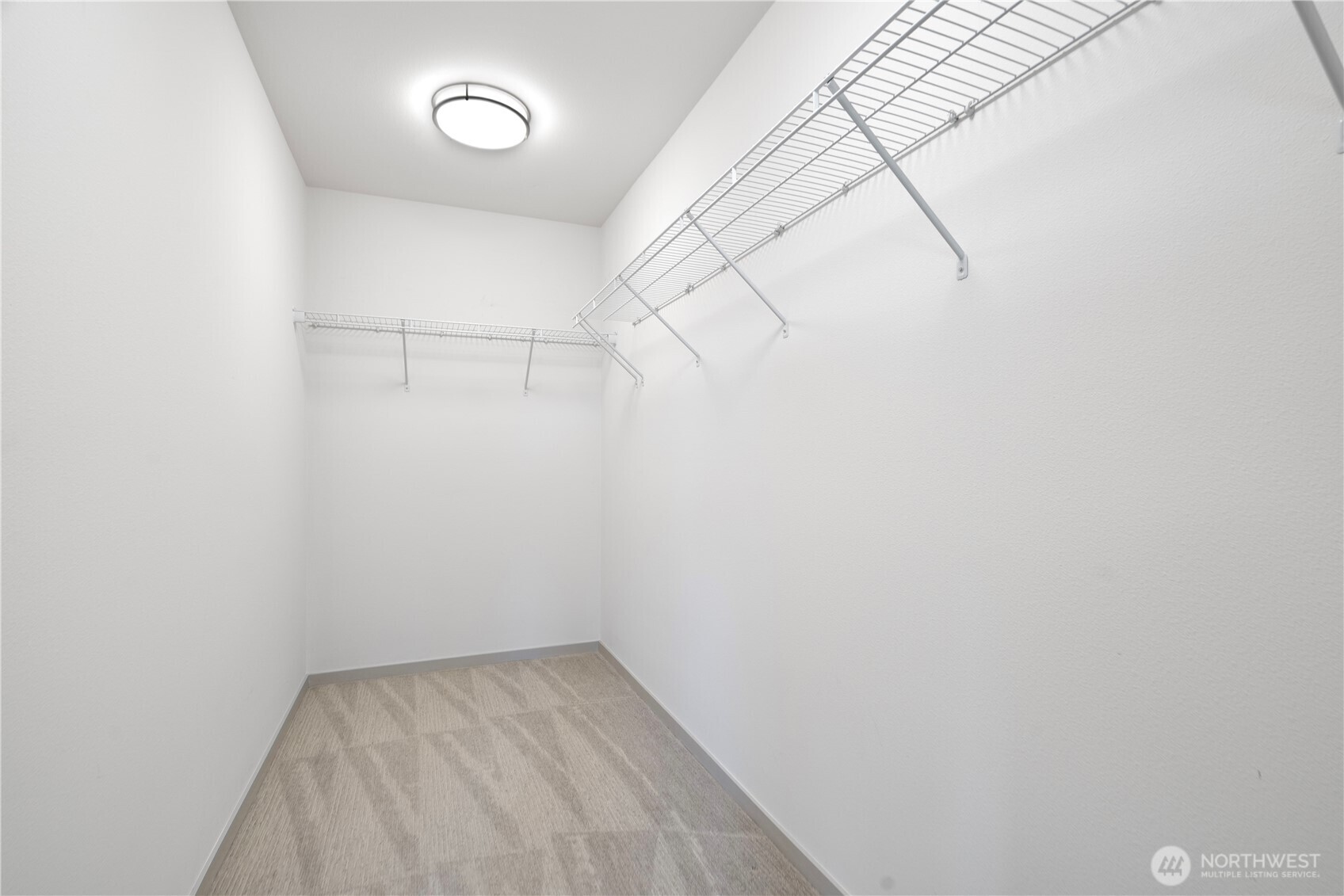 4416 Francis Avenue North, Unit B Seattle, WA 98103 - Photo 20 of 26 a view of a room with racks on the wall
