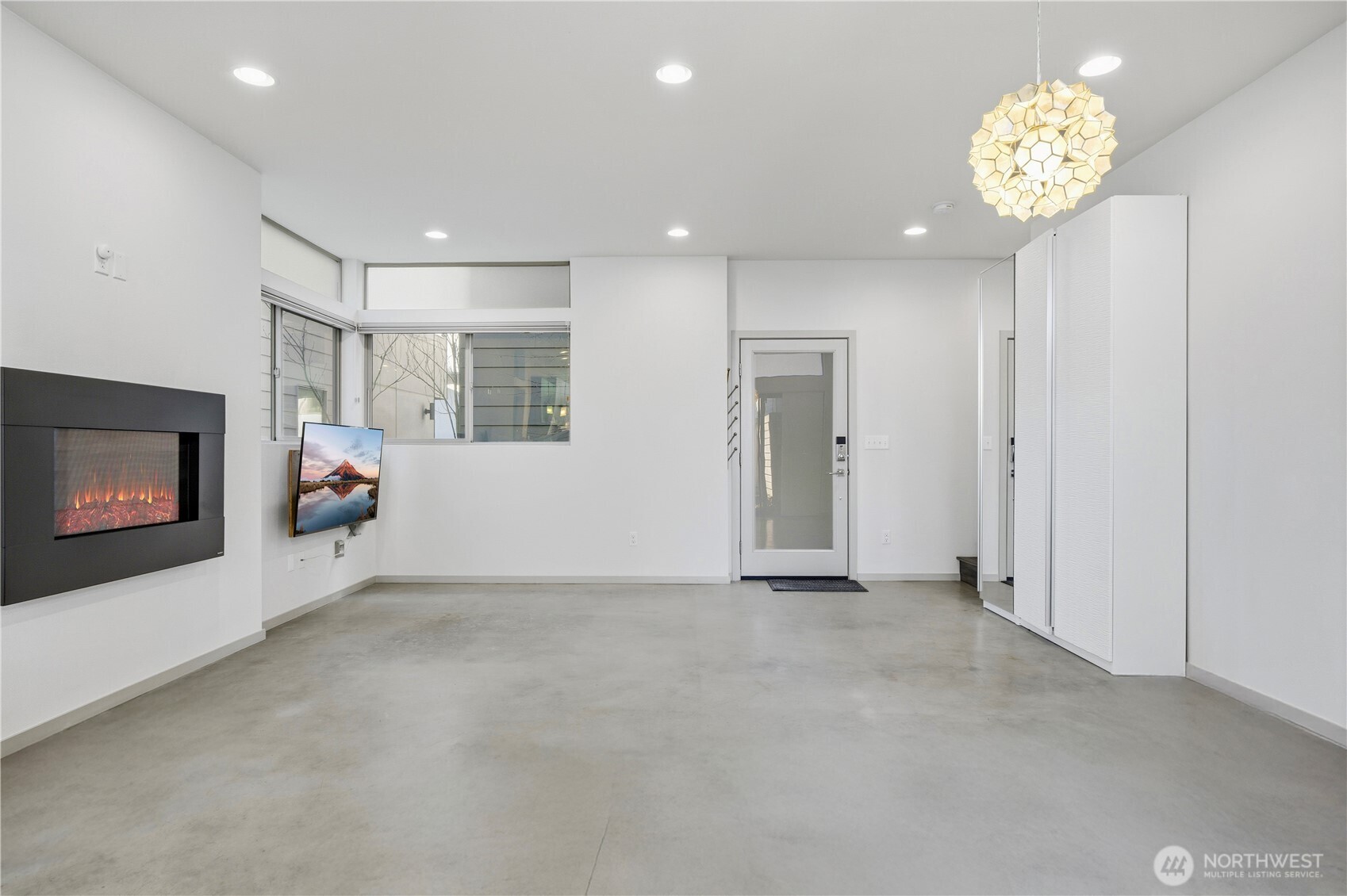 4416 Francis Avenue North, Unit B Seattle, WA 98103 - Photo 5 of 26 a view of an empty room with a chandelier