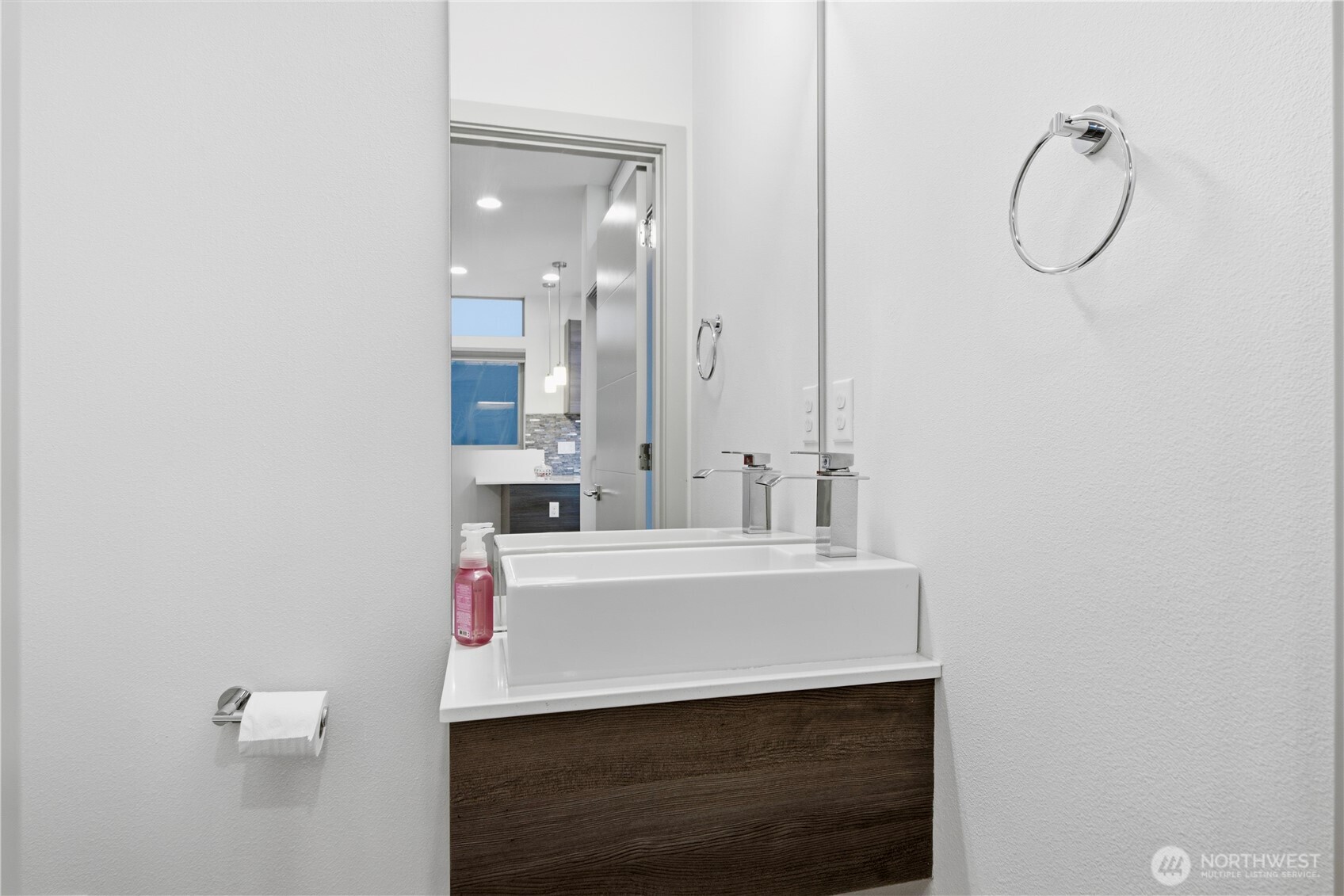 4416 Francis Avenue North, Unit B Seattle, WA 98103 - Photo 8 of 26 a bathroom with a sink and a mirror