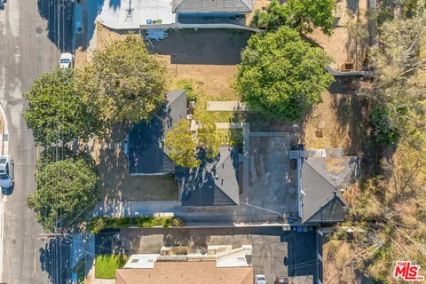 an aerial view of a house with swimming pool