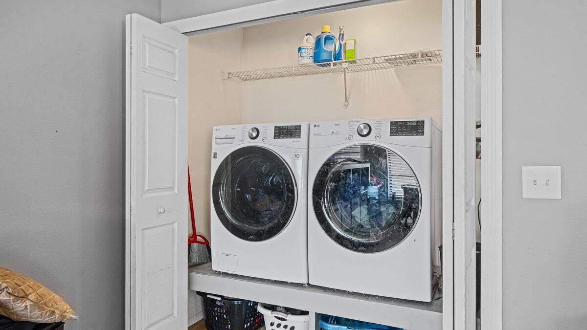 1645 Clover Circle Melbourne, FL 32935 - Photo 18 of 43 a utility room with dryer and washer