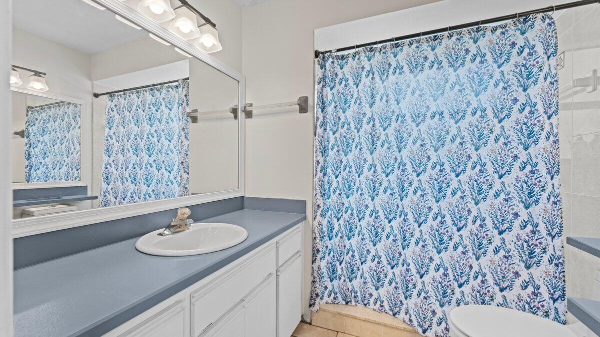 1645 Clover Circle Melbourne, FL 32935 - Photo 27 of 43 a bathroom with a sink toilet and shower