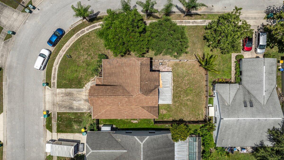 1645 Clover Circle Melbourne, FL 32935 - Photo 36 of 43 an aerial view of a house with a garden