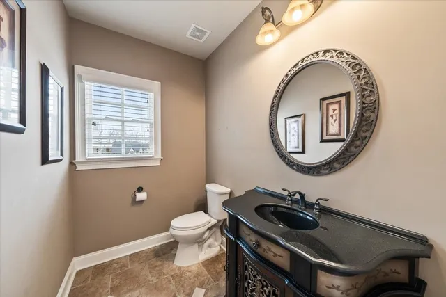 a view of a livingroom with wooden floor and a window